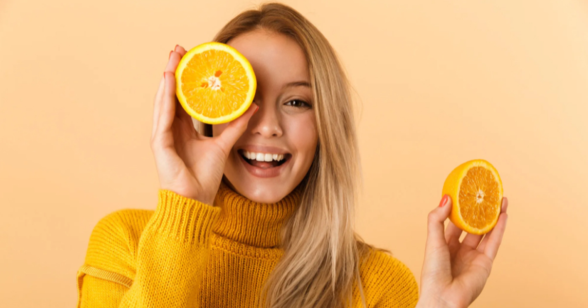 Woman eating a healthy orange